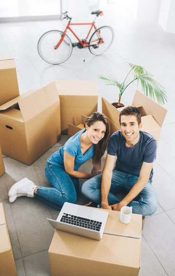 young couple moving boxes