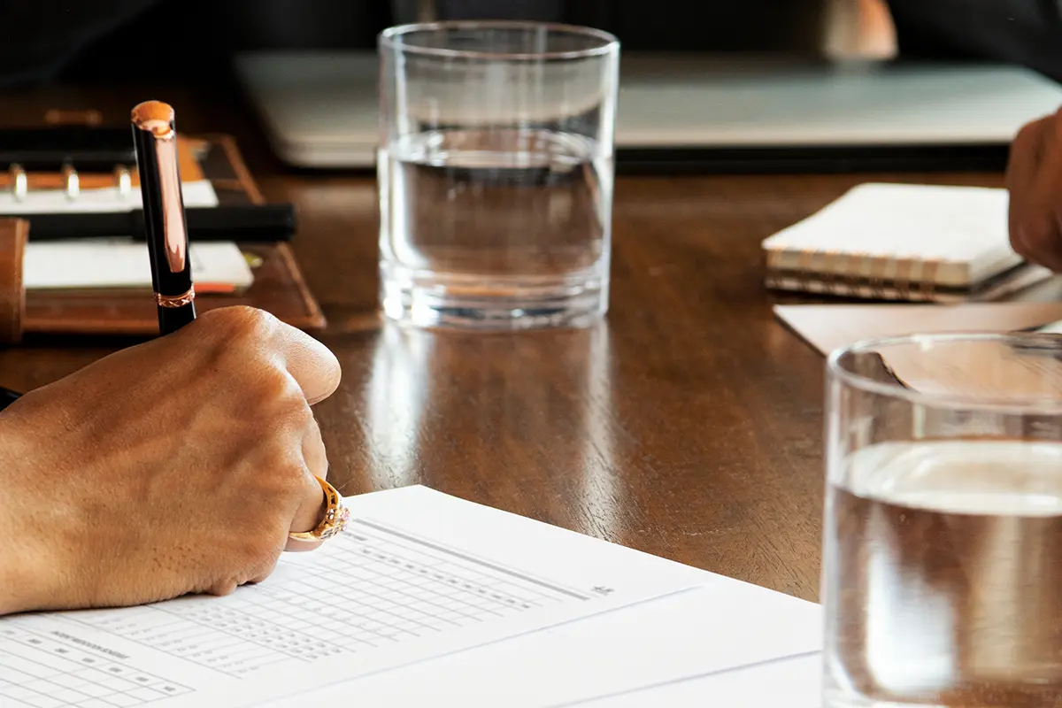 close up of someone marking up an annual report
